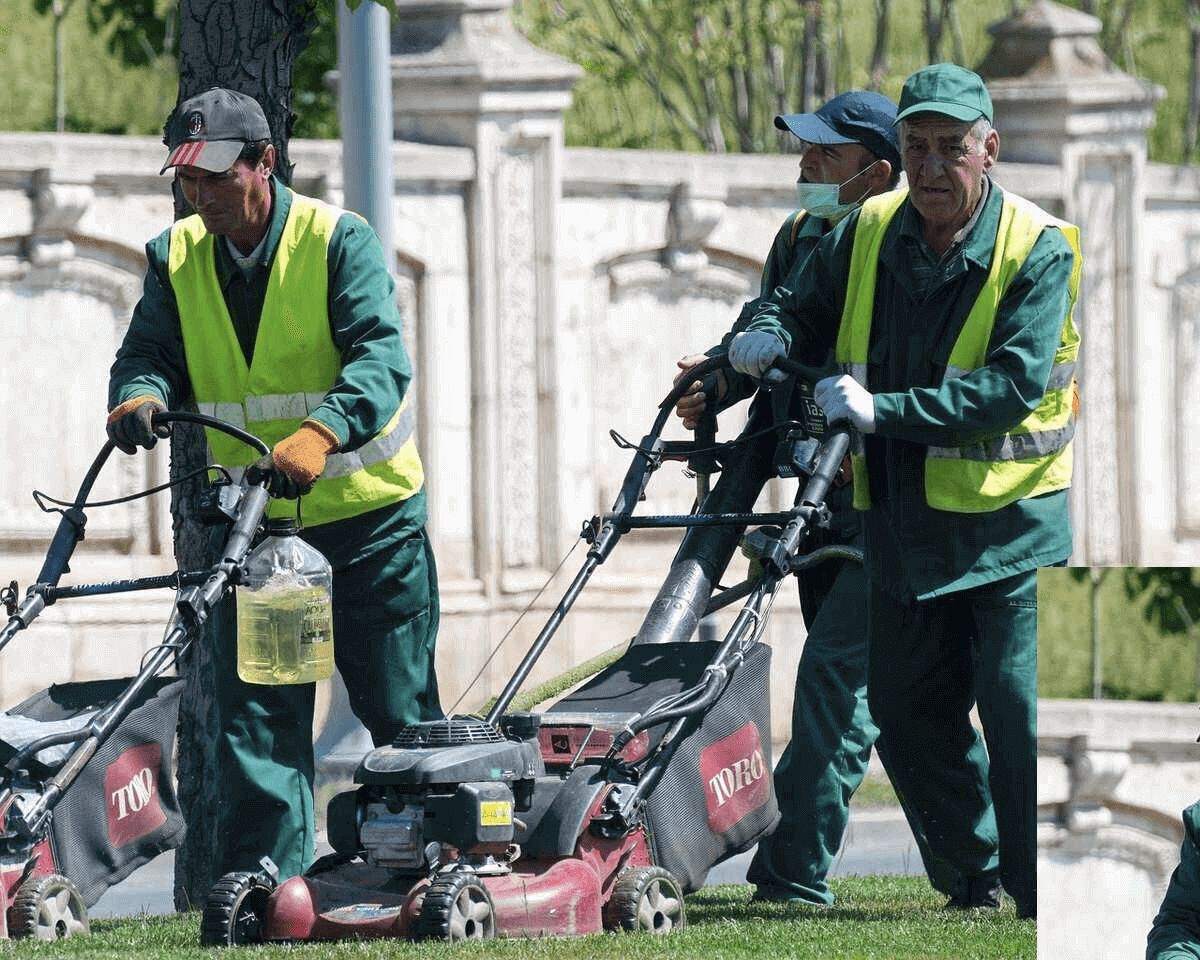 Lawn care business owners mowing a customer's lawn as part of a pricing strategy