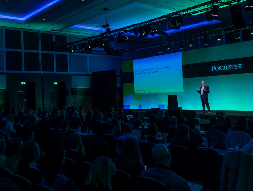 A speaker presents to attendees during a keynote session at Forrester B2B Forum.