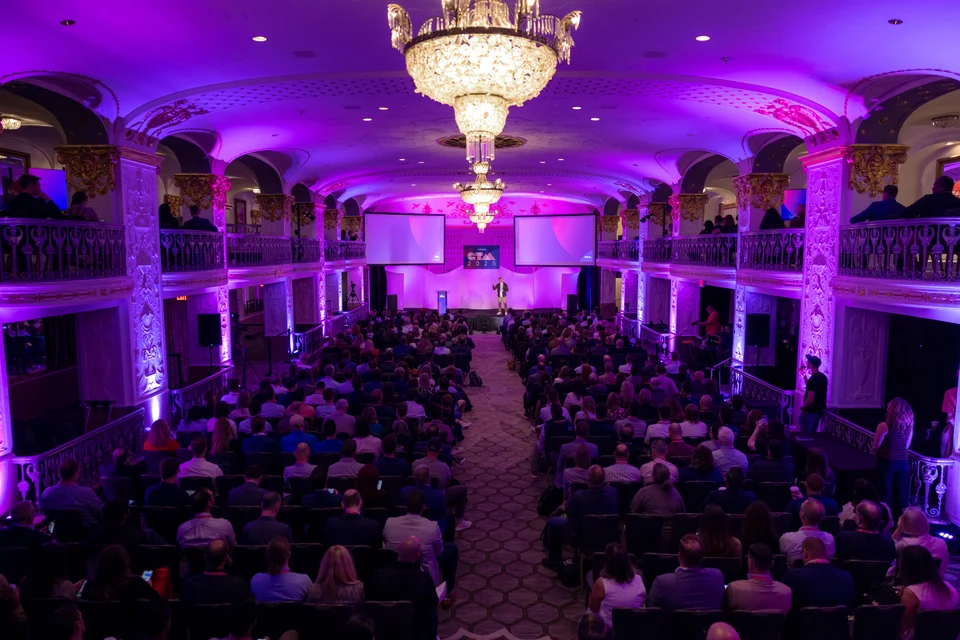 Attendees listen to a keynote presentation at GTM Conference