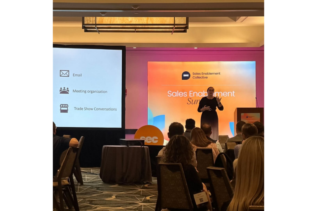 A speaker shares sales enablement strategies during a Sales Enablement Collective conference session