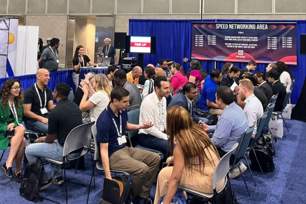 Attendees networking at The Business Show US speed networking area